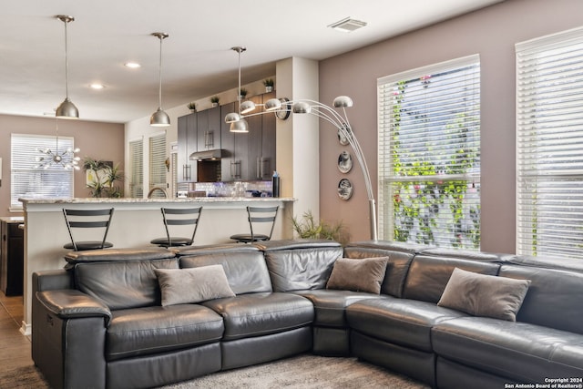 living room featuring a chandelier