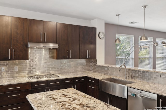 822 Emerald Bay, San Antonio, TX 78260 - kitchen featuring stainless steel appliances, under cabinet range hood, backsplash, dark brown cabinetry, and light stone countertops