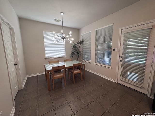 822 Emerald Bay, San Antonio, TX 78260 - dining room featuring dark tile patterned floors and a chandelier