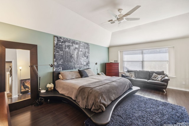 bedroom with hardwood / wood-style flooring, vaulted ceiling, and ceiling fan