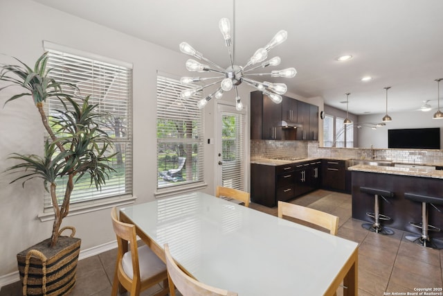 822 Emerald Bay, San Antonio, TX 78260 - dining area with light tile patterned flooring, a chandelier, and recessed lighting