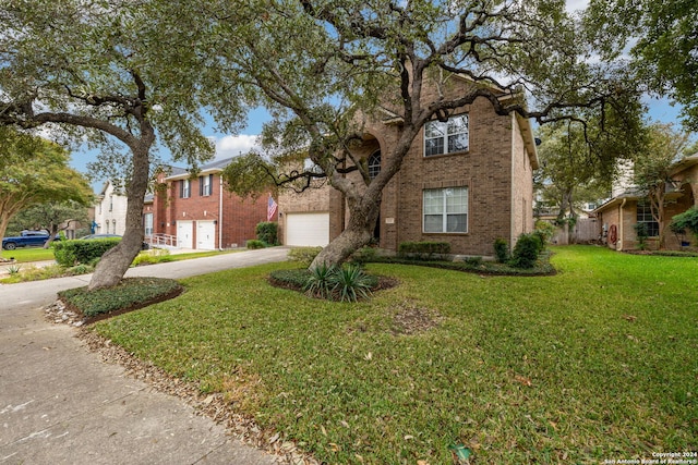 view of front of house featuring a front lawn and a garage