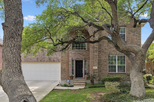 822 Emerald Bay, San Antonio, TX 78260 - traditional-style home with brick siding, driveway, and an attached garage