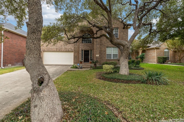 view of front of house featuring a front lawn and a garage