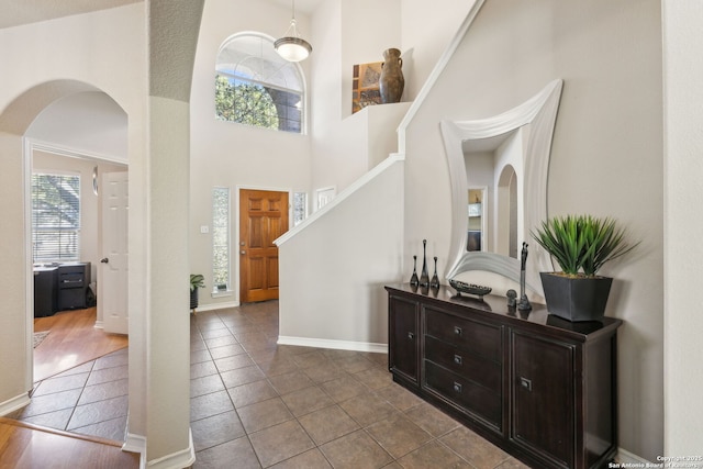 822 Emerald Bay, San Antonio, TX 78260 - foyer entrance with arched walkways, tile patterned floors, a towering ceiling, and stairway