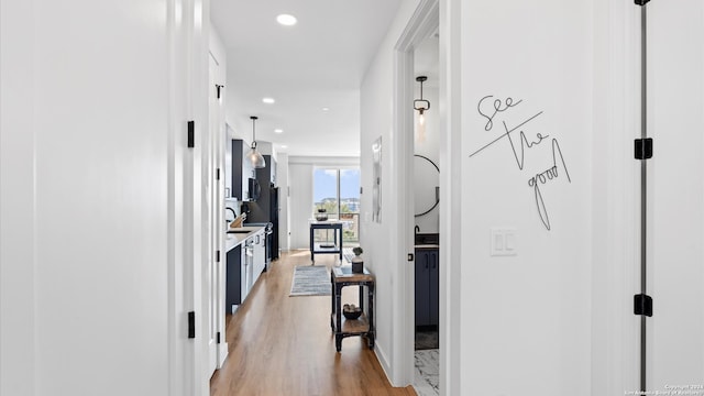 hallway featuring light hardwood / wood-style flooring