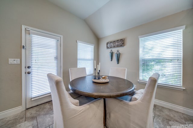 dining space with lofted ceiling