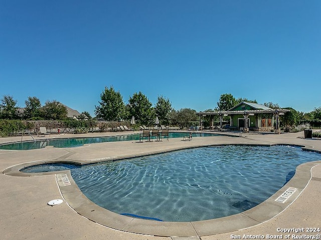 view of swimming pool featuring a gazebo and a patio area