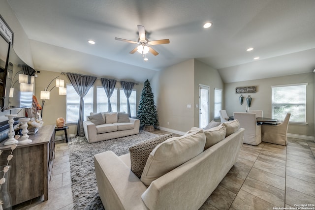 living room with ceiling fan and lofted ceiling