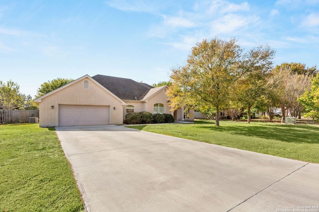 view of front facade with a front lawn and a garage