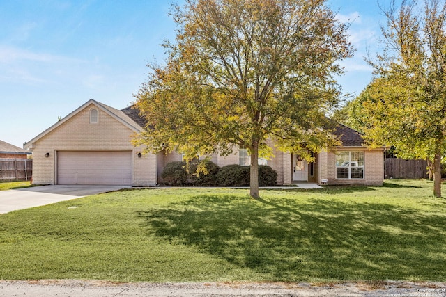 view of front of home featuring a front yard and a garage