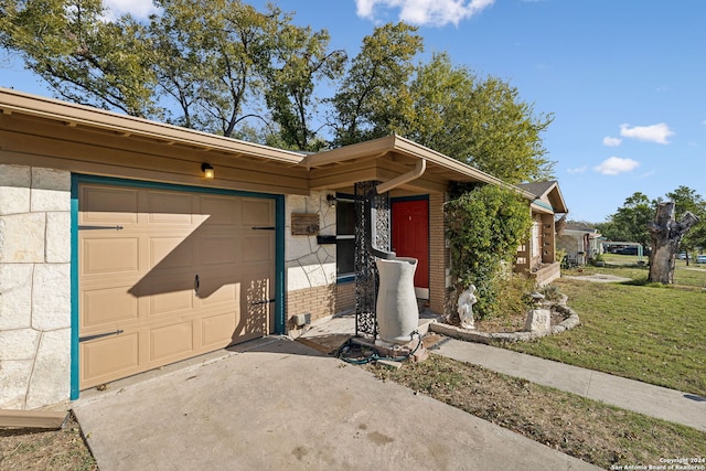 view of front of property with a garage and a front yard