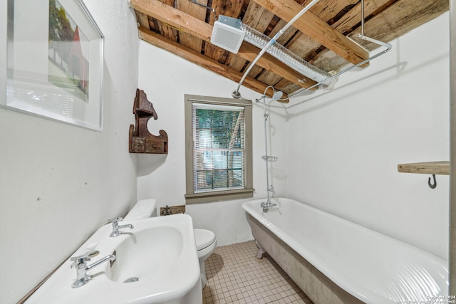 bathroom with tile patterned floors, a bathing tub, vaulted ceiling with beams, toilet, and wood ceiling