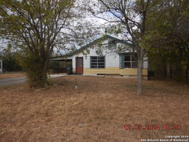 view of front of property with a carport