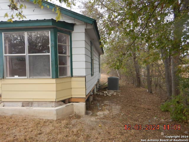 view of home's exterior featuring cooling unit