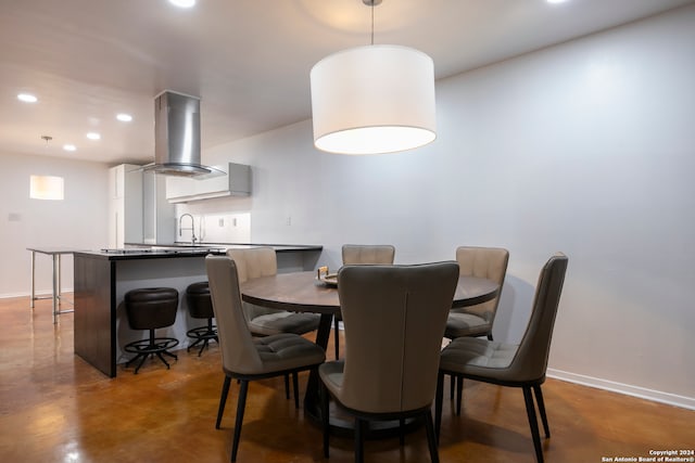 dining room featuring sink