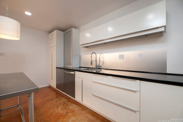 kitchen with white cabinetry, sink, dishwasher, and pendant lighting