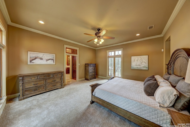 carpeted bedroom featuring ceiling fan and crown molding