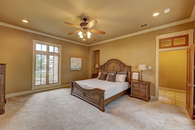 carpeted bedroom featuring ceiling fan and ornamental molding