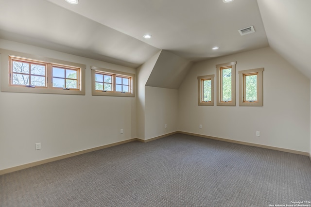 bonus room featuring carpet and lofted ceiling