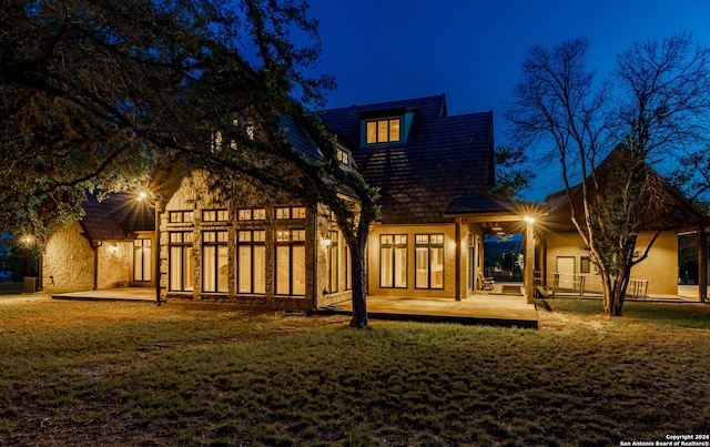 view of back house at night