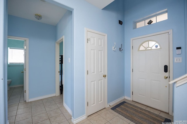 foyer featuring light tile patterned flooring