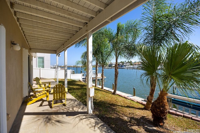 view of patio with a water view