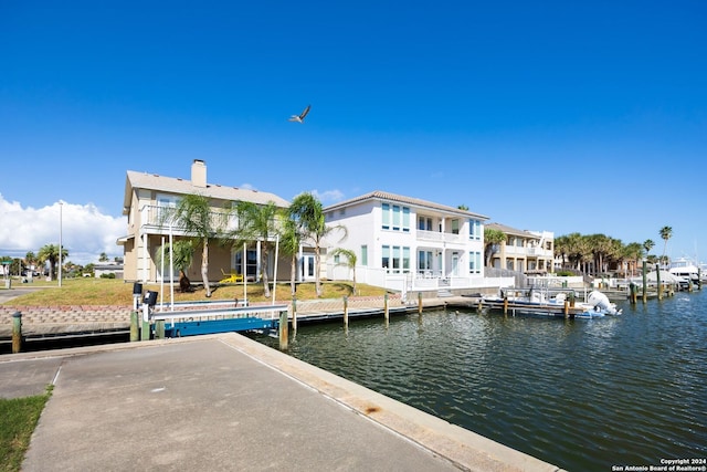 back of house featuring a water view