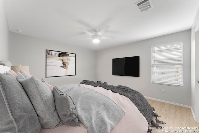 bedroom featuring ceiling fan and light hardwood / wood-style flooring