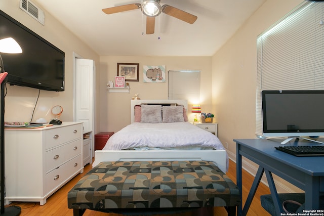 bedroom with ceiling fan and light hardwood / wood-style flooring