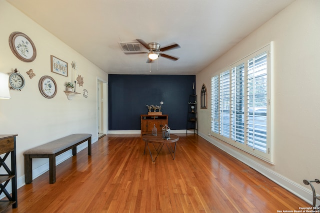 interior space with hardwood / wood-style floors and ceiling fan