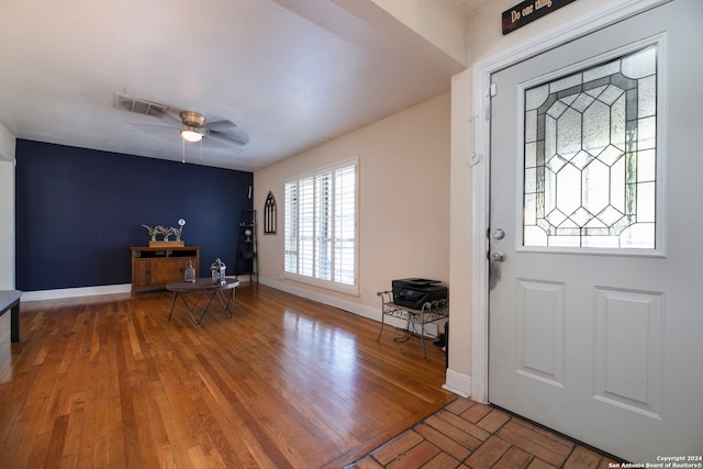 entrance foyer with wood-type flooring and ceiling fan