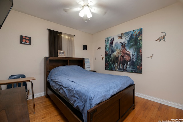 bedroom with ceiling fan and light hardwood / wood-style floors