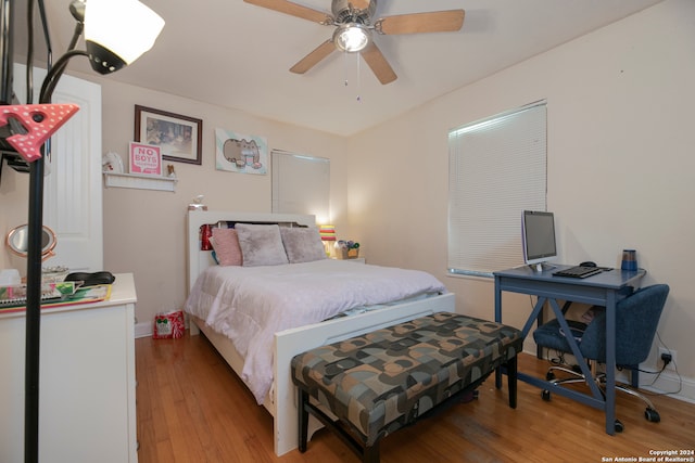 bedroom with ceiling fan and light wood-type flooring