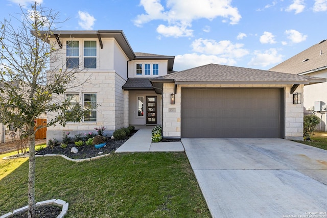 1521 Escarpment, New Braunfels, TX 78132 - prairie-style house featuring stone siding, a garage, a front yard, and concrete driveway