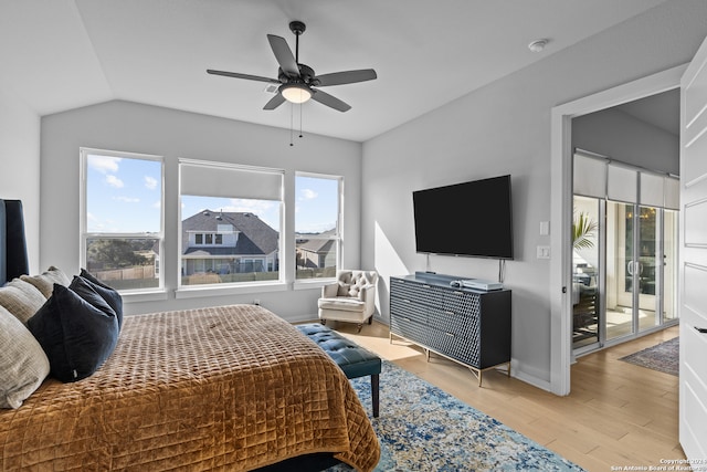 bedroom with access to outside, light hardwood / wood-style floors, multiple windows, and ceiling fan