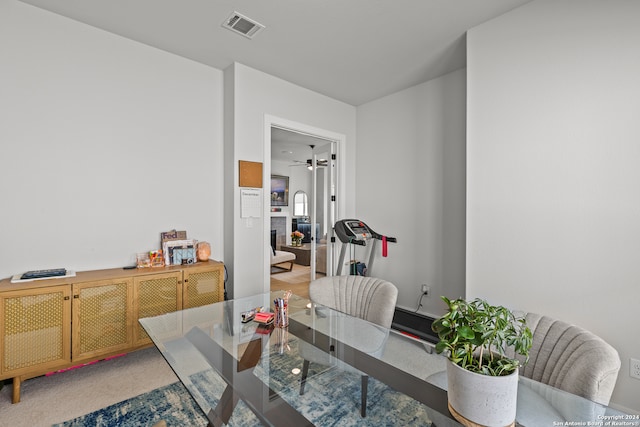 dining room with carpet flooring and ceiling fan