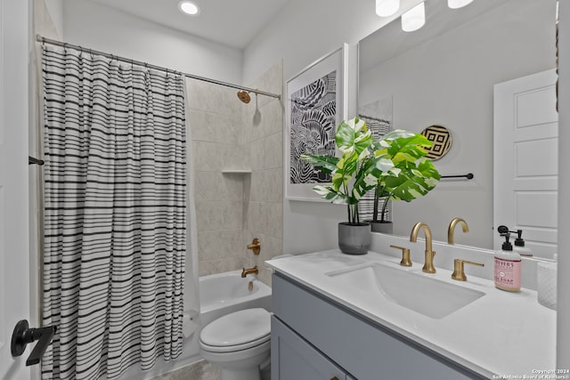 full bathroom with vanity, toilet, and shower / bath combo with shower curtain