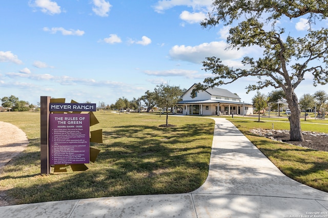 view of home's community featuring a lawn