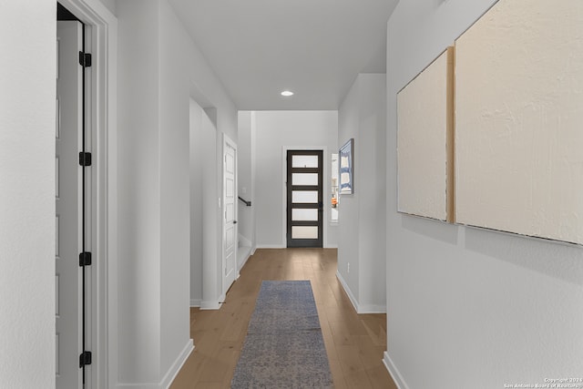 hallway featuring light hardwood / wood-style flooring