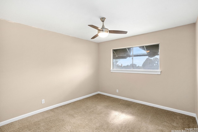 empty room with ceiling fan and carpet floors