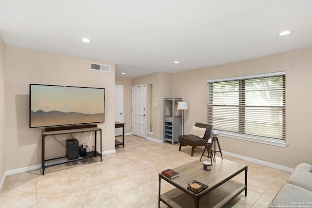 living room with light tile patterned flooring