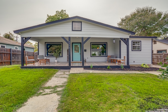 view of front facade with covered porch and a front yard