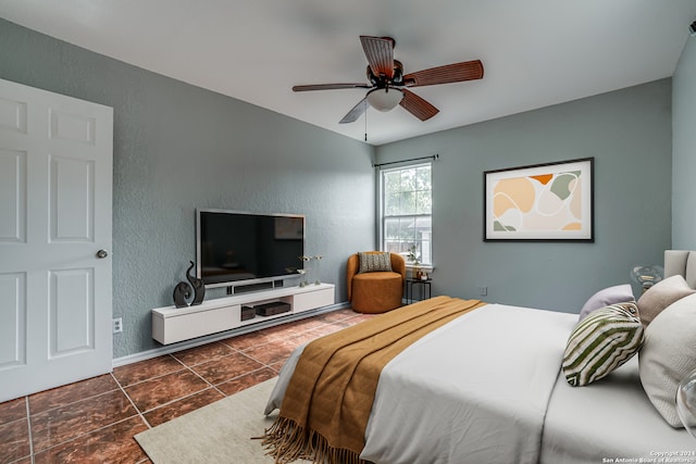 tiled bedroom with ceiling fan