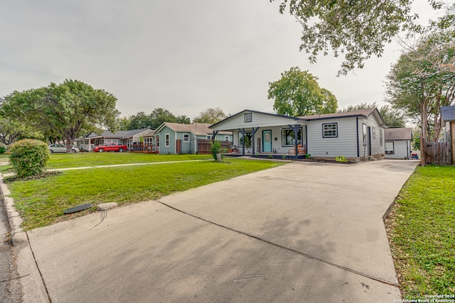 view of front of home featuring covered porch and a front yard