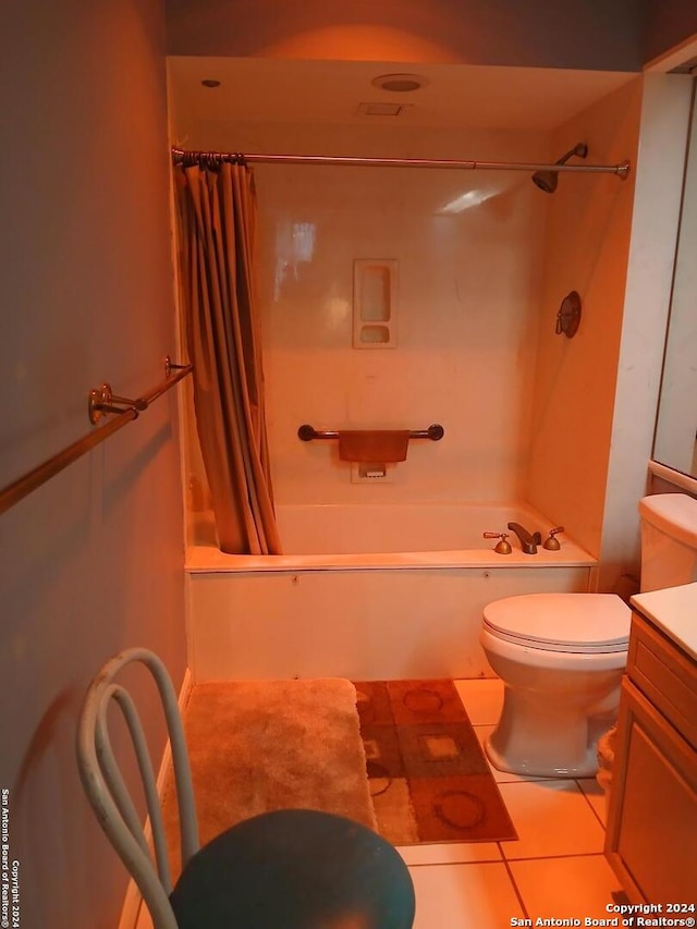 full bathroom featuring tile patterned flooring, vanity, toilet, and shower / bathtub combination with curtain