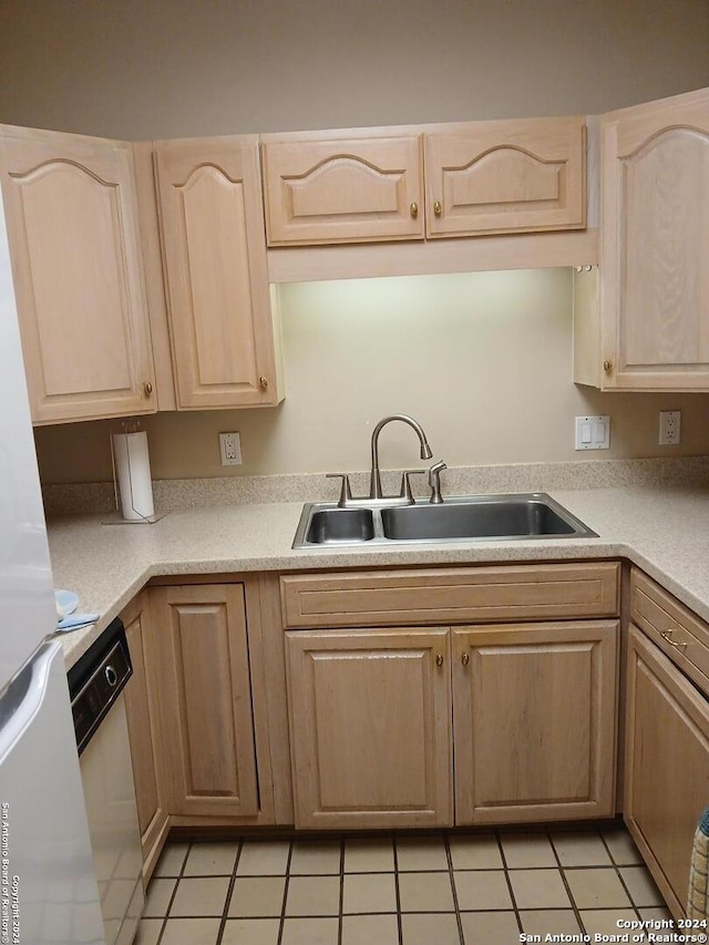 kitchen featuring sink and light brown cabinetry