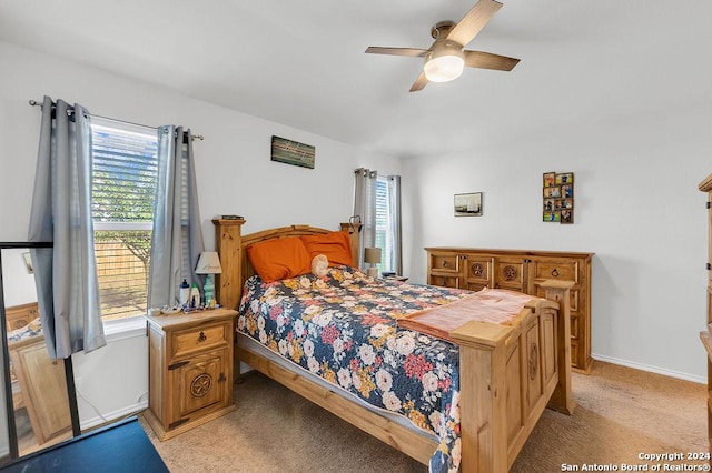 bedroom with light colored carpet and ceiling fan