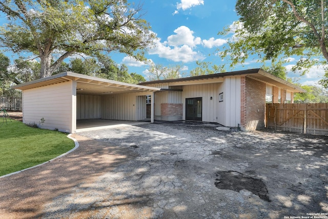 view of front of property with a carport