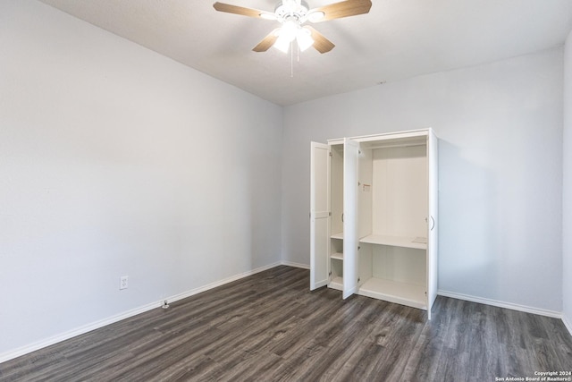 unfurnished bedroom with ceiling fan, a closet, and dark wood-type flooring